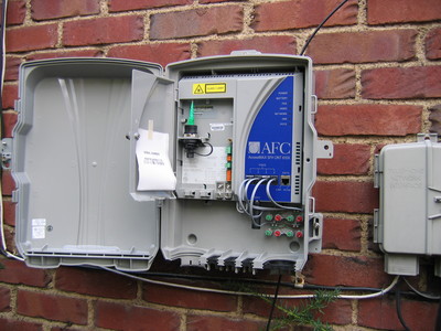 new optical network terminal next to old POTS junction box